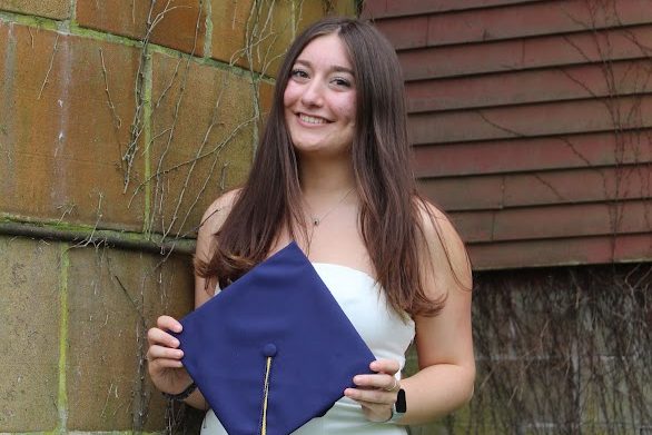 Student holding their graduation cap