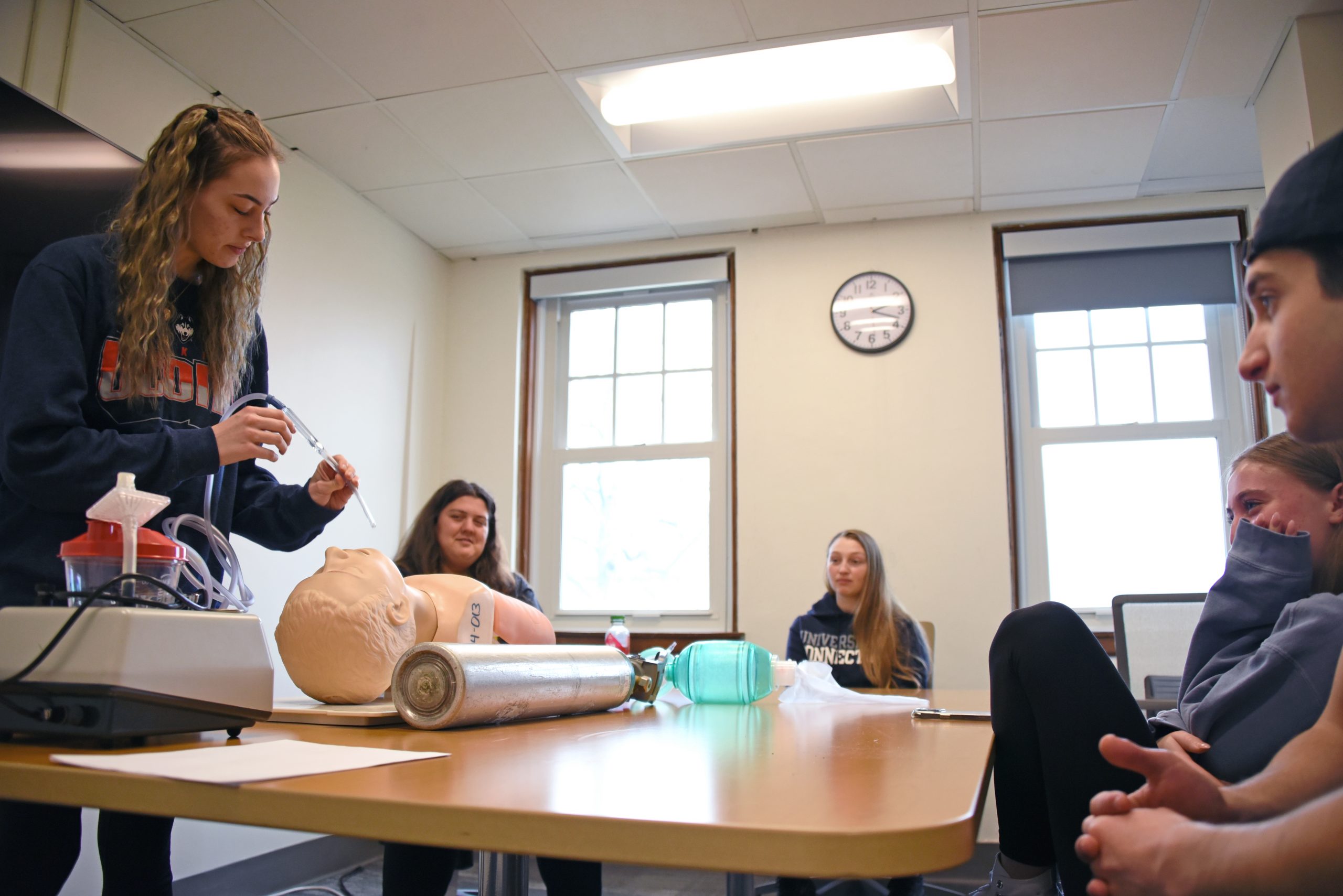 Students practice medical techniques in EMT Training