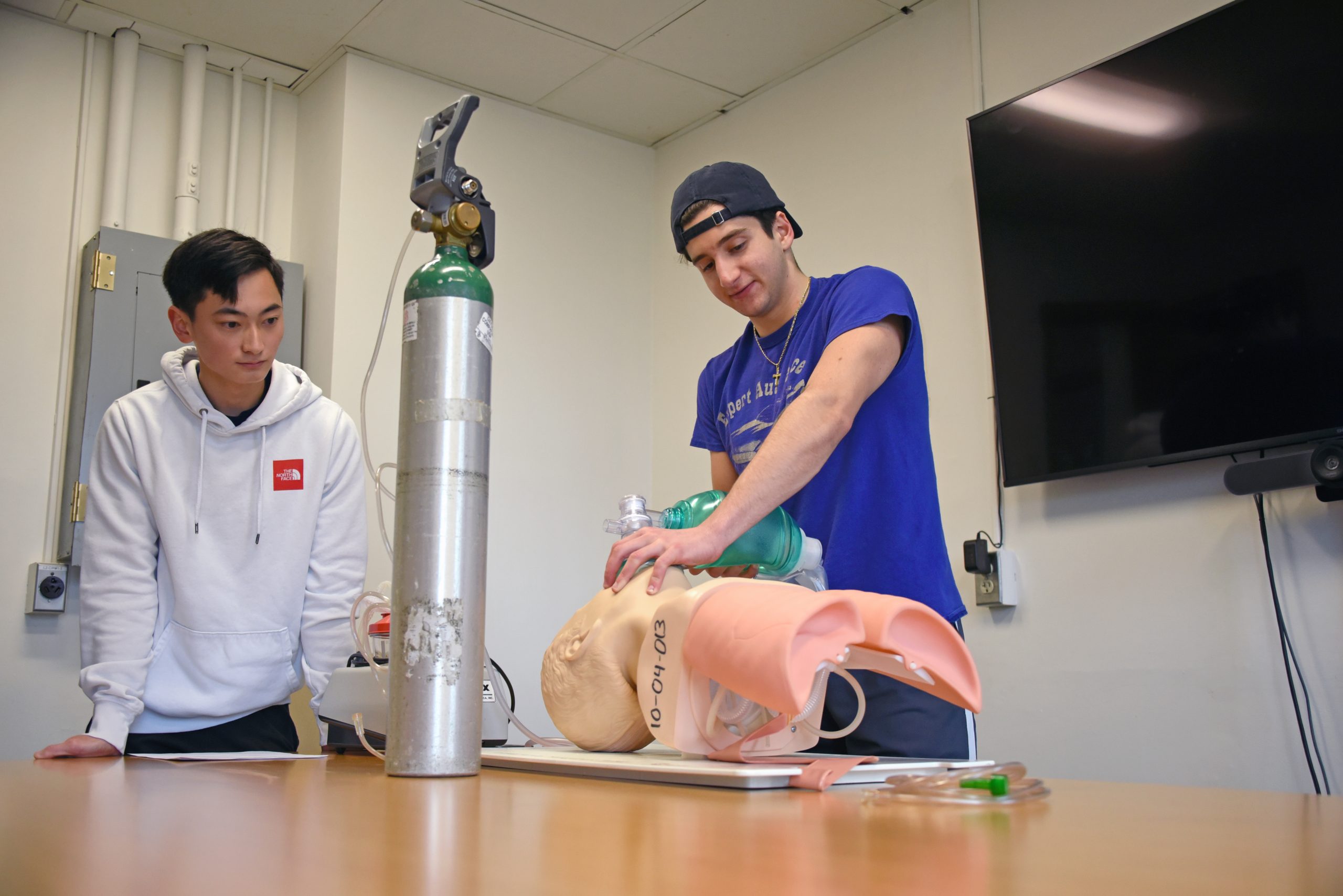 Students practice medical techniques in EMT Training