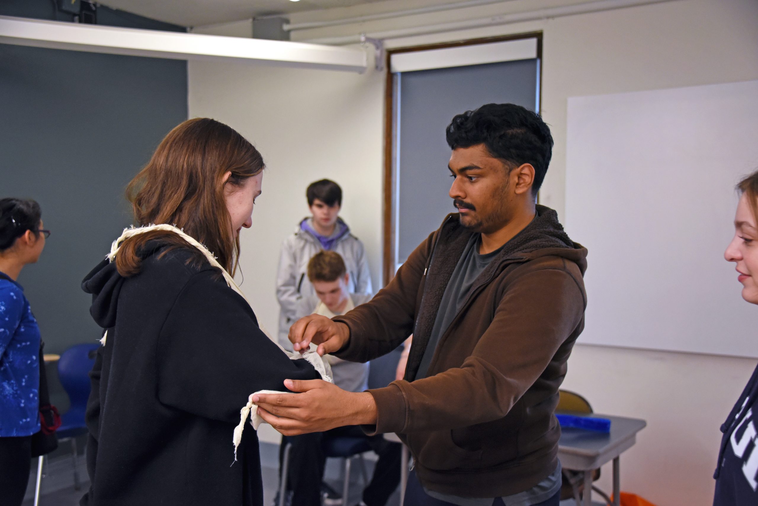 Students practice medical techniques in EMT Training