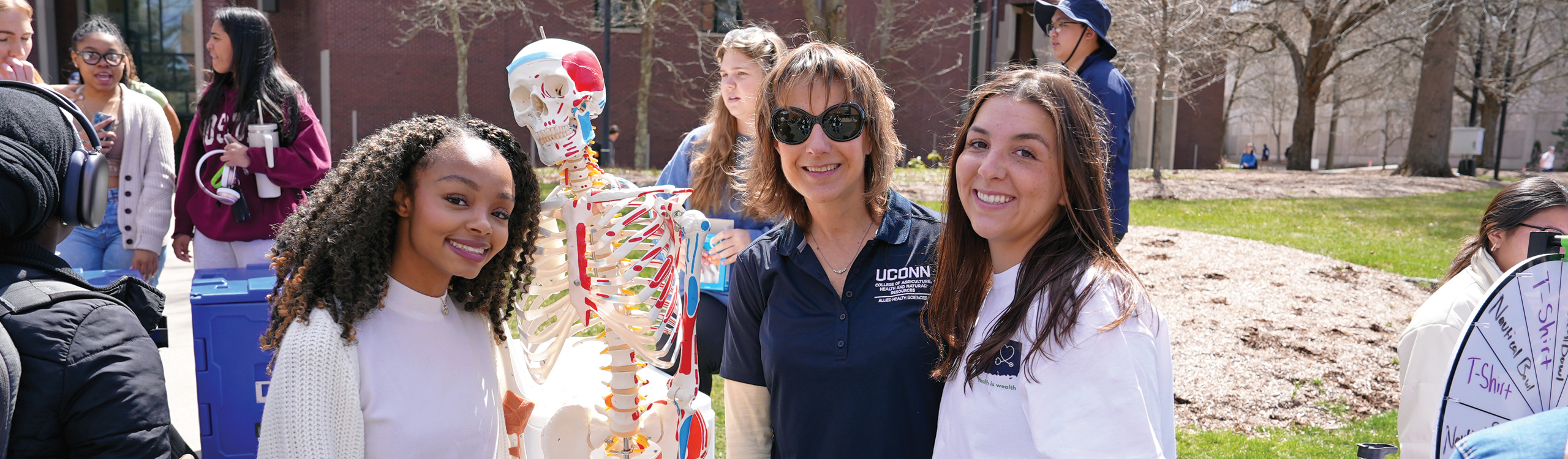 group shot with a skeleton at an event